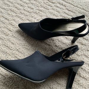 Bandolino gently used heel. Size 9. Black satin with thin gold trim on bottom.